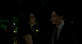 Movie still from “Comet” (2014), directed by Sam Esmail – A man and a woman standing next to each other in the dark; Close Up shot, Low angle