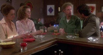 Movie still from “Coming Home” (1978), directed by Hal Ashby – A man and a woman sitting at a bar; Medium shot, Over the shoulder angle