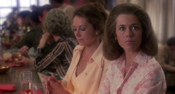 Movie still from “Coming Home” (1978), directed by Hal Ashby – A couple of women sitting next to each other in a room; Close Up shot, Over the shoulder angle