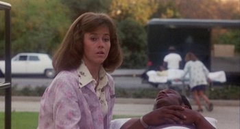 Movie still from “Coming Home” (1978), directed by Hal Ashby – A woman standing next to a man laying on the ground; Medium shot, Low angle