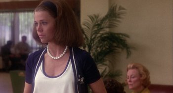 Movie still from “Coming Home” (1978), directed by Hal Ashby – A woman in a white shirt and a blue jacket; Medium shot, Over the shoulder angle