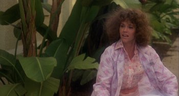 Movie still from “Coming Home” (1978), directed by Hal Ashby – A woman in a floral shirt and a pink skirt; Medium shot, Low angle