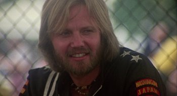 Movie still from “Coming Home” (1978), directed by Hal Ashby – A person with long blond hair; Close Up shot, Low angle