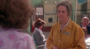 Movie still from “Coming Home” (1978), directed by Hal Ashby – Two women are talking to each other in a room; Medium shot, Over the shoulder angle