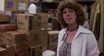 Movie still from “Coming Home” (1978), directed by Hal Ashby – A woman standing in front of boxes in a warehouse; Close Up shot, Low angle