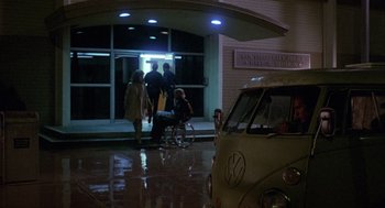 Movie still from “Coming Home” (1978), directed by Hal Ashby – A van parked in front of a building at night; Wide shot, Over the shoulder angle