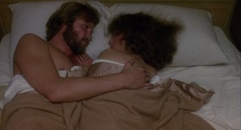 Movie still from “Coming Home” (1978), directed by Hal Ashby – A man and a woman laying in a bed together; Close Up shot, Overhead angle