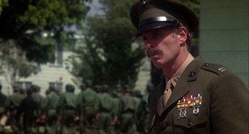 Movie still from “Coming Home” (1978), directed by Hal Ashby – A man in a military uniform standing in front of a group of soldiers; Close Up shot, Low angle