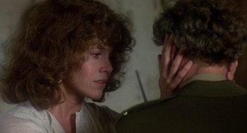 Movie still from “Coming Home” (1978), directed by Hal Ashby – A woman with curly red hair is talking to a man; Close Up shot, Over the shoulder angle