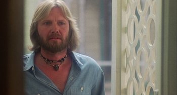 Movie still from “Coming Home” (1978), directed by Hal Ashby – A person with long hair and a beard; Close Up shot, Low angle