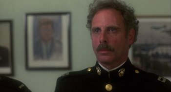 Movie still from “Coming Home” (1978), directed by Hal Ashby – A person wearing a military uniform; Close Up shot, Over the shoulder angle