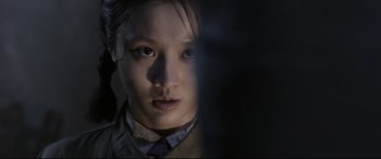 Movie still from “Coming Home” (2014), directed by Yimou Zhang – A young girl is looking into the camera; Close Up shot, Low angle