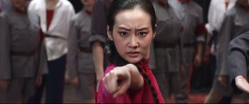 Movie still from “Coming Home” (2014), directed by Yimou Zhang – A woman in a red dress points at the camera; Close Up shot, Over the shoulder angle