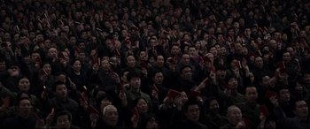 Movie still from “Coming Home” (2014), directed by Yimou Zhang – A group of people sitting in a room holding red envelopes in their hands; Extreme Wide shot, High angle