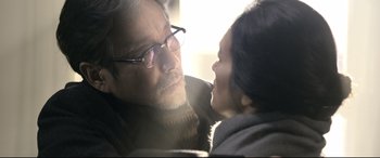 Movie still from “Coming Home” (2014), directed by Yimou Zhang – An older man and a younger woman looking at each other; Close Up shot, Over the shoulder angle