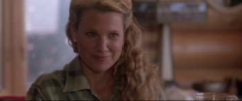 Movie still from “Communion” (1989), directed by Philippe Mora – A person with long blonde hair; Close Up shot, Over the shoulder angle