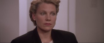 Movie still from “Communion” (1989), directed by Philippe Mora – A person wearing a jacket; Close Up shot, Low angle