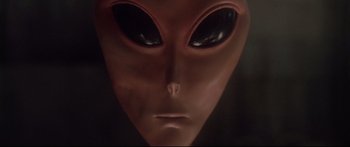 Movie still from “Communion” (1989), directed by Philippe Mora – An extraterrestrials face; Close Up shot, Low angle