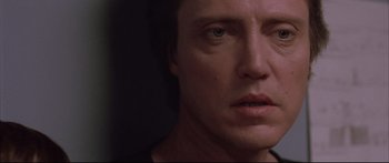 Movie still from “Communion” (1989), directed by Philippe Mora – A man's face in the dark; Close Up shot, Low angle