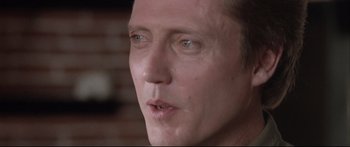 Movie still from “Communion” (1989), directed by Philippe Mora – A man's face with tears in his eyes; Close Up shot, Low angle