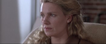 Movie still from “Communion” (1989), directed by Philippe Mora – A person with long hair; Close Up shot, Low angle