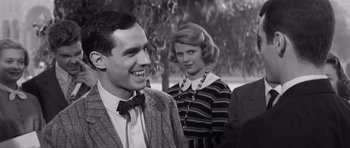 Movie still from “Compulsion” (1959), directed by Richard Fleischer – A black and white photo of a man and a woman; Medium shot, Over the shoulder angle