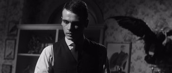 Movie still from “Compulsion” (1959), directed by Richard Fleischer – A black and white photo of a man in a suit; Close Up shot, Low angle