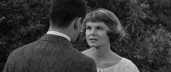 Movie still from “Compulsion” (1959), directed by Richard Fleischer – A man and a woman talking to each other; Close Up shot, Over the shoulder angle