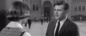 Movie still from “Compulsion” (1959), directed by Richard Fleischer – A black and white photo of a man and a woman; Close Up shot, Over the shoulder angle