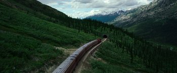 Movie still from “The Equalizer 2” (2018), directed by Antoine Fuqua – A train traveling down tracks through a tunnel; Extreme Wide shot, High angle