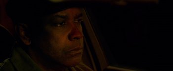 Movie still from “The Equalizer 2” (2018), directed by Antoine Fuqua – A person sitting in a car; Close Up shot, Low angle