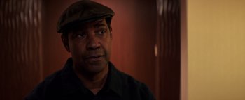 Movie still from “The Equalizer 2” (2018), directed by Antoine Fuqua – A person wearing a hat; Close Up shot, Over the shoulder angle