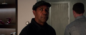 Movie still from “The Equalizer 2” (2018), directed by Antoine Fuqua – A person wearing a hat; Close Up shot, Over the shoulder angle