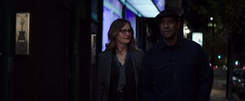 Movie still from “The Equalizer 2” (2018), directed by Antoine Fuqua – A woman and a man walking down a street; Medium shot, Low angle