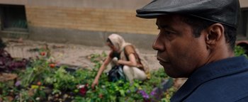 Movie still from “The Equalizer 2” (2018), directed by Antoine Fuqua – A man and a woman working in a flower garden; Close Up shot, Over the shoulder angle