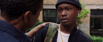 Movie still from “The Equalizer 2” (2018), directed by Antoine Fuqua – A young man is being comforted by another man; Close Up shot, Over the shoulder angle