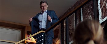 Movie still from “The Equalizer 2” (2018), directed by Antoine Fuqua – A man in a suit standing on the stairs; Medium shot, Over the shoulder angle