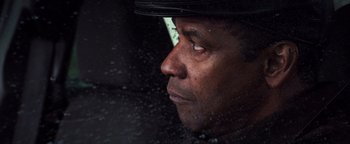 Movie still from “The Equalizer 2” (2018), directed by Antoine Fuqua – A person wearing a hat; Close Up shot, Over the shoulder angle