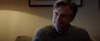 Movie still from “The Equalizer 2” (2018), directed by Antoine Fuqua – A person sitting in a room; Close Up shot, Over the shoulder angle