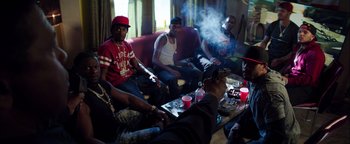 Movie still from “The Equalizer 2” (2018), directed by Antoine Fuqua – A group of people sitting around a table; Medium shot, High angle