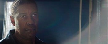 Movie still from “The Equalizer 2” (2018), directed by Antoine Fuqua – A man's face in the dark; Close Up shot, Low angle