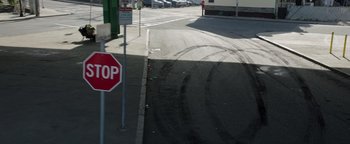 A stop sign on the side of the street