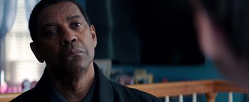 Movie still from “The Equalizer 2” (2018), directed by Antoine Fuqua – A person wearing a black shirt; Close Up shot, Over the shoulder angle