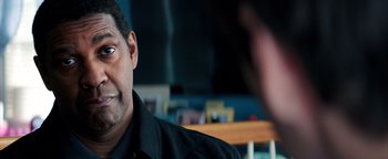 Movie still from “The Equalizer 2” (2018), directed by Antoine Fuqua – A person wearing a black shirt; Close Up shot, Over the shoulder angle