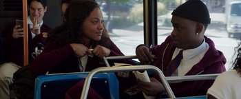 Movie still from “The Equalizer 2” (2018), directed by Antoine Fuqua – A woman sitting on a public transit bus; Medium shot, Over the shoulder angle