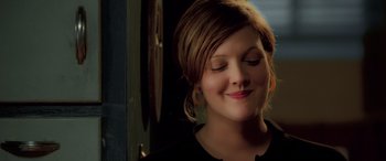 Movie still from “Confessions of a Dangerous Mind” (2002), directed by George Clooney – A person with her eyes closed; Close Up shot, Over the shoulder angle