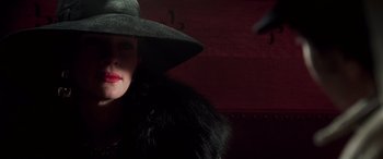 Movie still from “Confessions of a Dangerous Mind” (2002), directed by George Clooney – A woman wearing a black hat and a fur coat; Close Up shot, Low angle