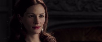 Movie still from “Confessions of a Dangerous Mind” (2002), directed by George Clooney – A person with long red hair; Close Up shot, Over the shoulder angle