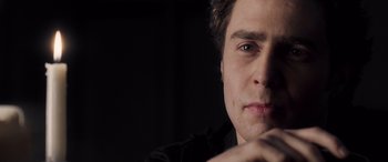 Movie still from “Confessions of a Dangerous Mind” (2002), directed by George Clooney – A person with a black shirt on; Close Up shot, Over the shoulder angle