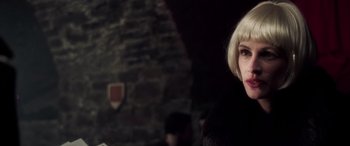 Movie still from “Confessions of a Dangerous Mind” (2002), directed by George Clooney – A person with blond hair; Close Up shot, Over the shoulder angle